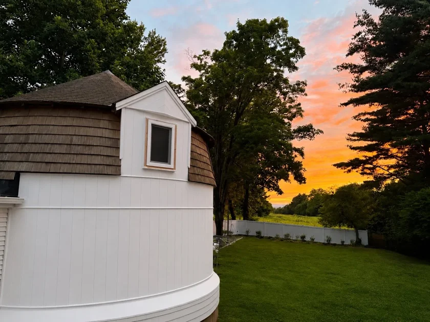 The Silo in warm evening light beneath a sunset sky.